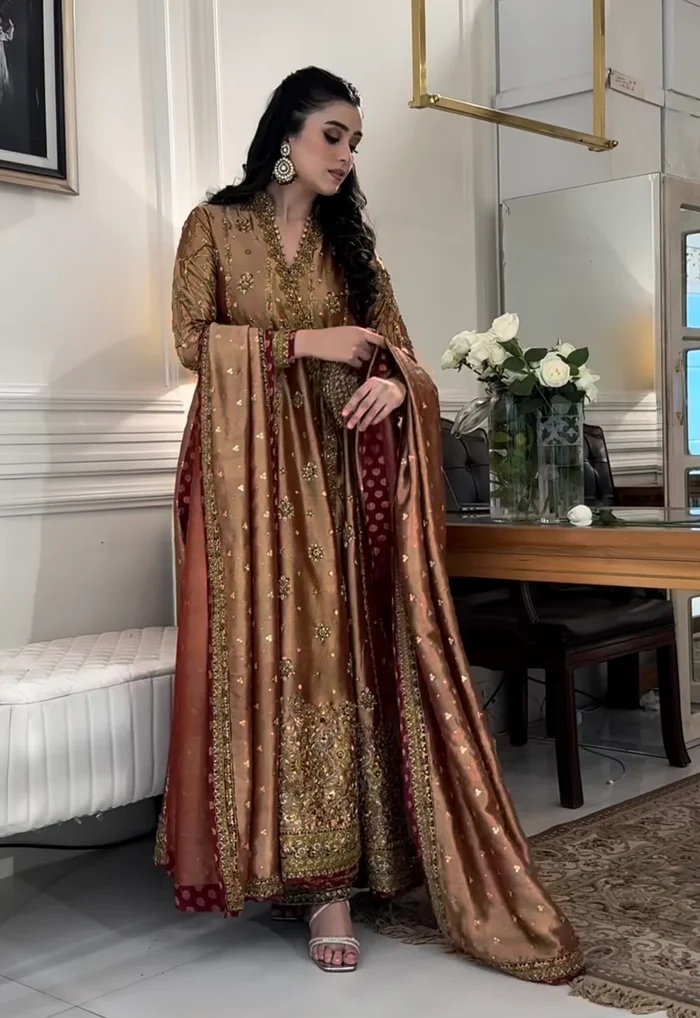 Haris Shakeel Aswad Pakistani fashion outfit in gold tones.